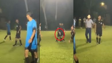 صورة حكم يشهر بطاقة حمراء ثم يطلق النار نحو أحد اللاعبين أثناء مباراة لكرة القدم- فيديو